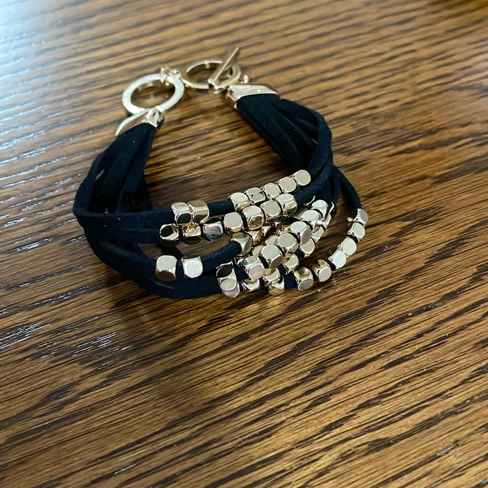 Black and gold bracelet with hook through